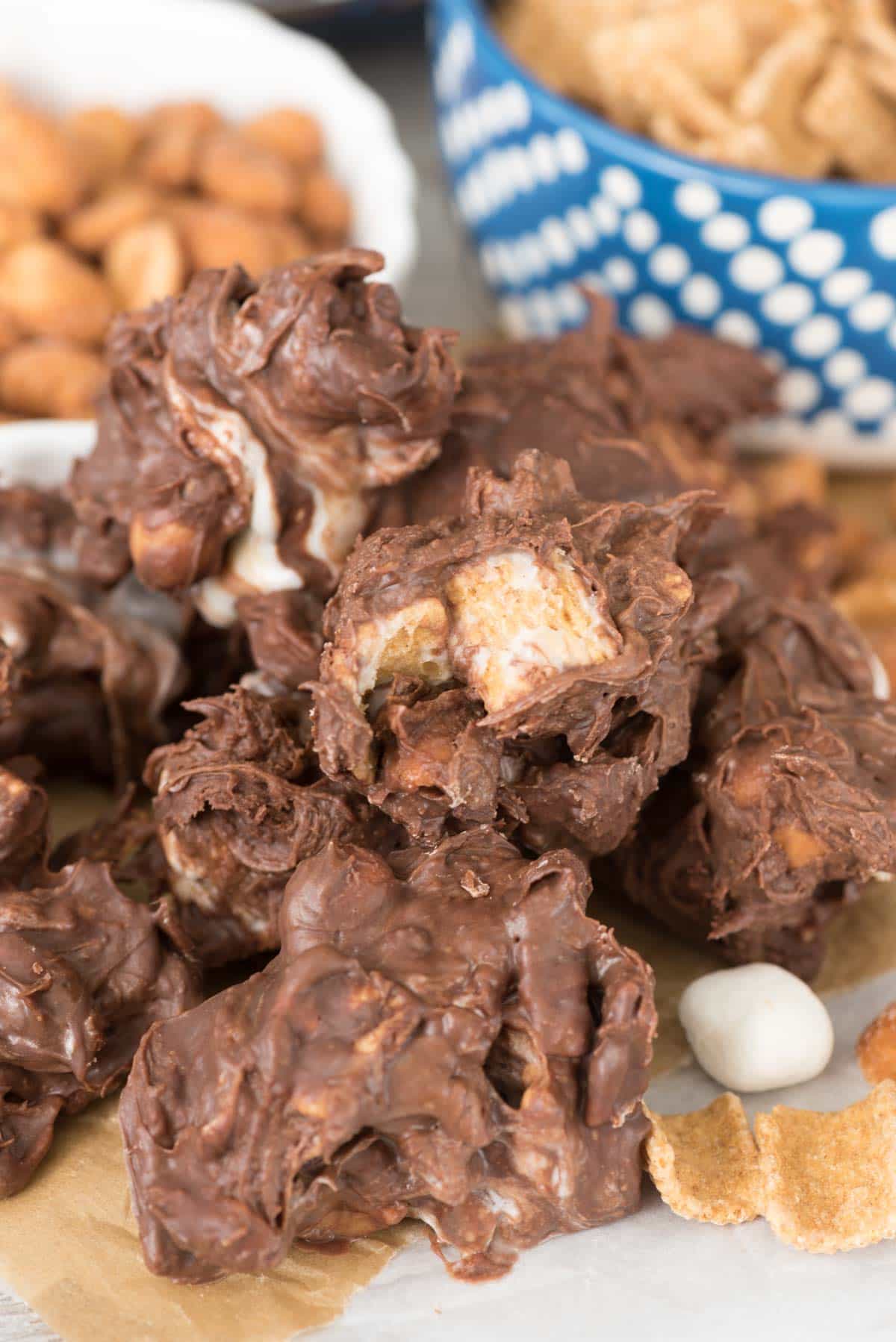 Gooey Nutty S'mores Crockpot Candy - this easy recipe has just 5 ingredients and can be made in the crockpot! The drop candy is easy and full of chocolate, grahams, and peanuts with gooey marshmallows too!
