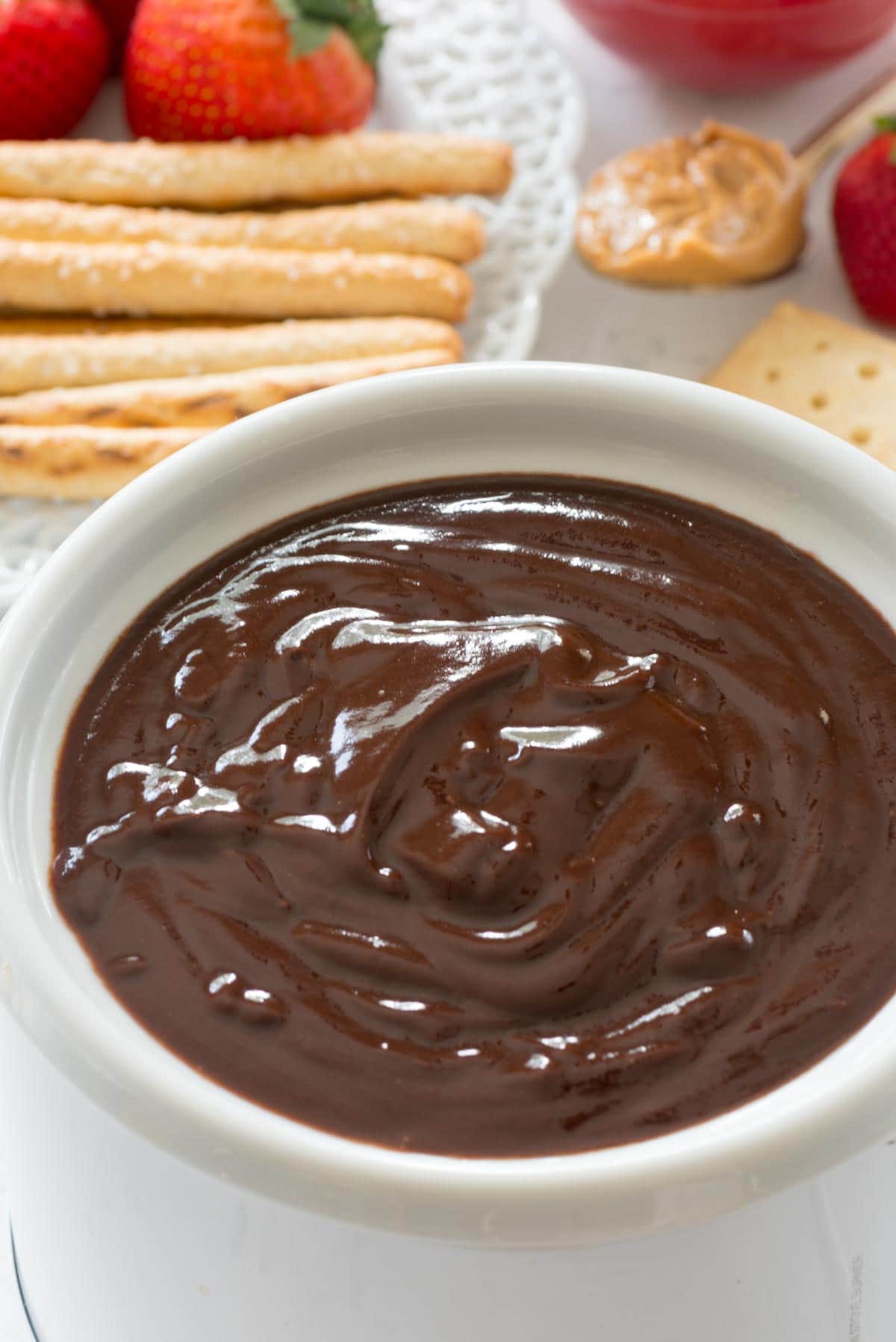 Peanut Butter Chocolate Fondue - this EASY fondue recipe has just 3 ingredients. It's full of peanut butter and chocolate and is a great party dip!