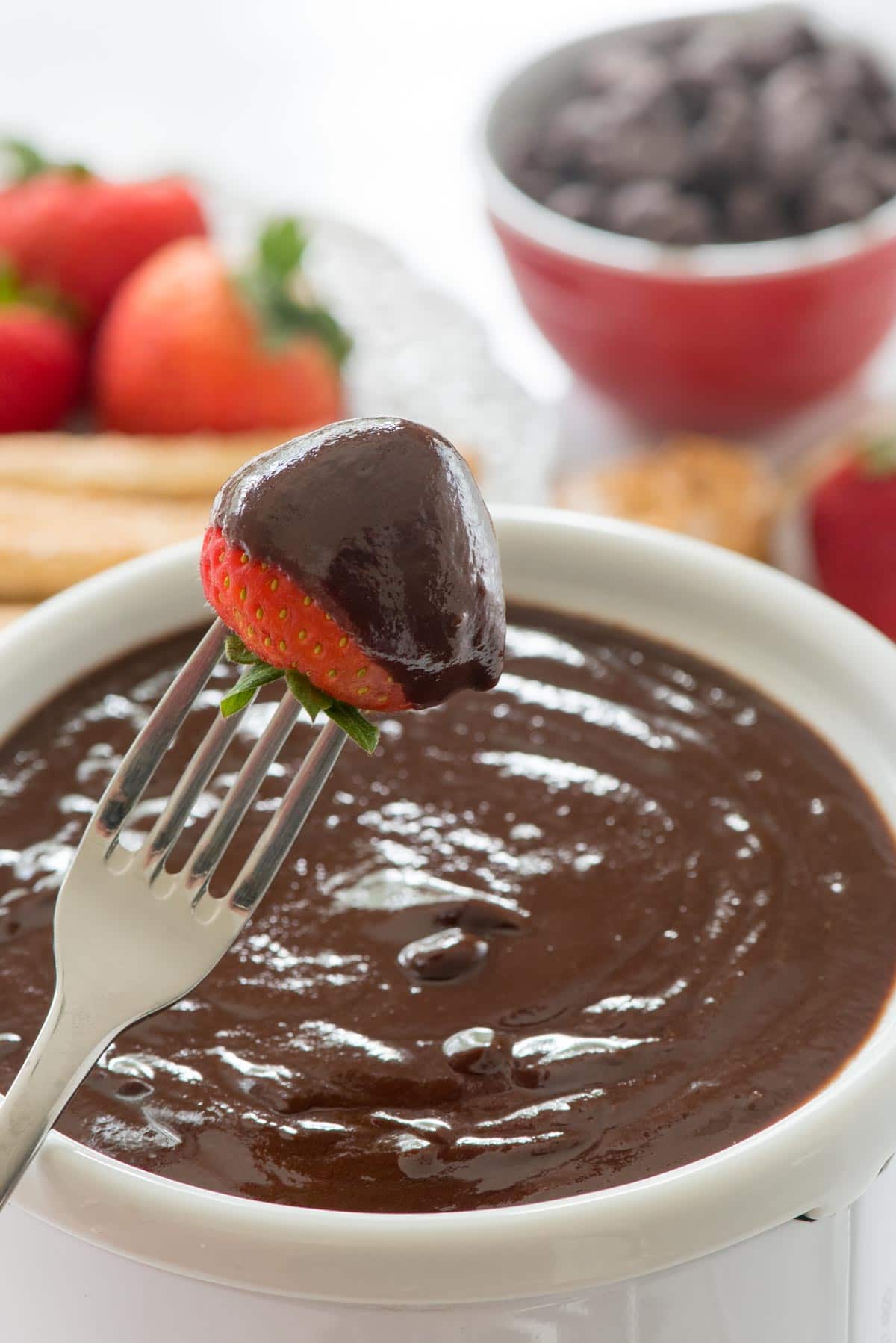 Peanut Butter Chocolate Fondue - this EASY fondue recipe has just 3 ingredients. It's full of peanut butter and chocolate and is a great party dip!