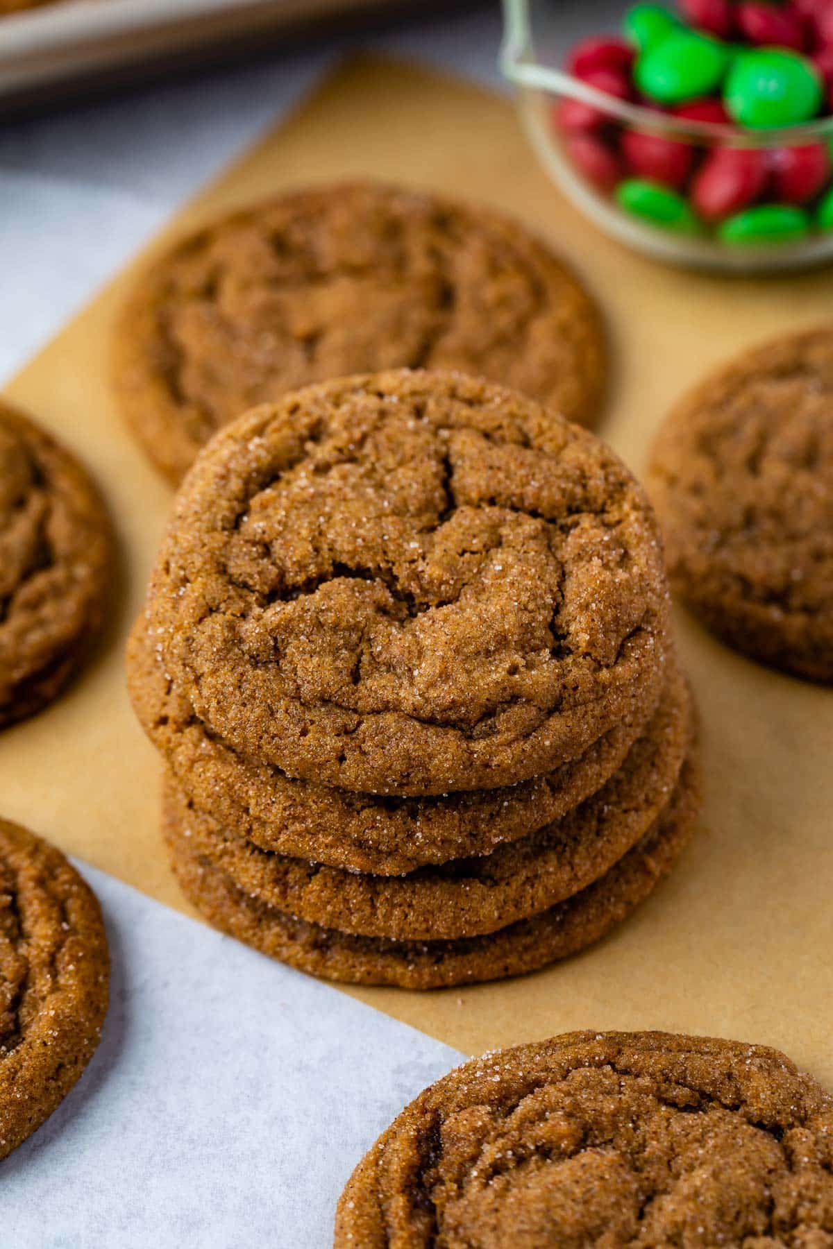 STACK OF 4 MOLASSES COOKIES on brown parchment 