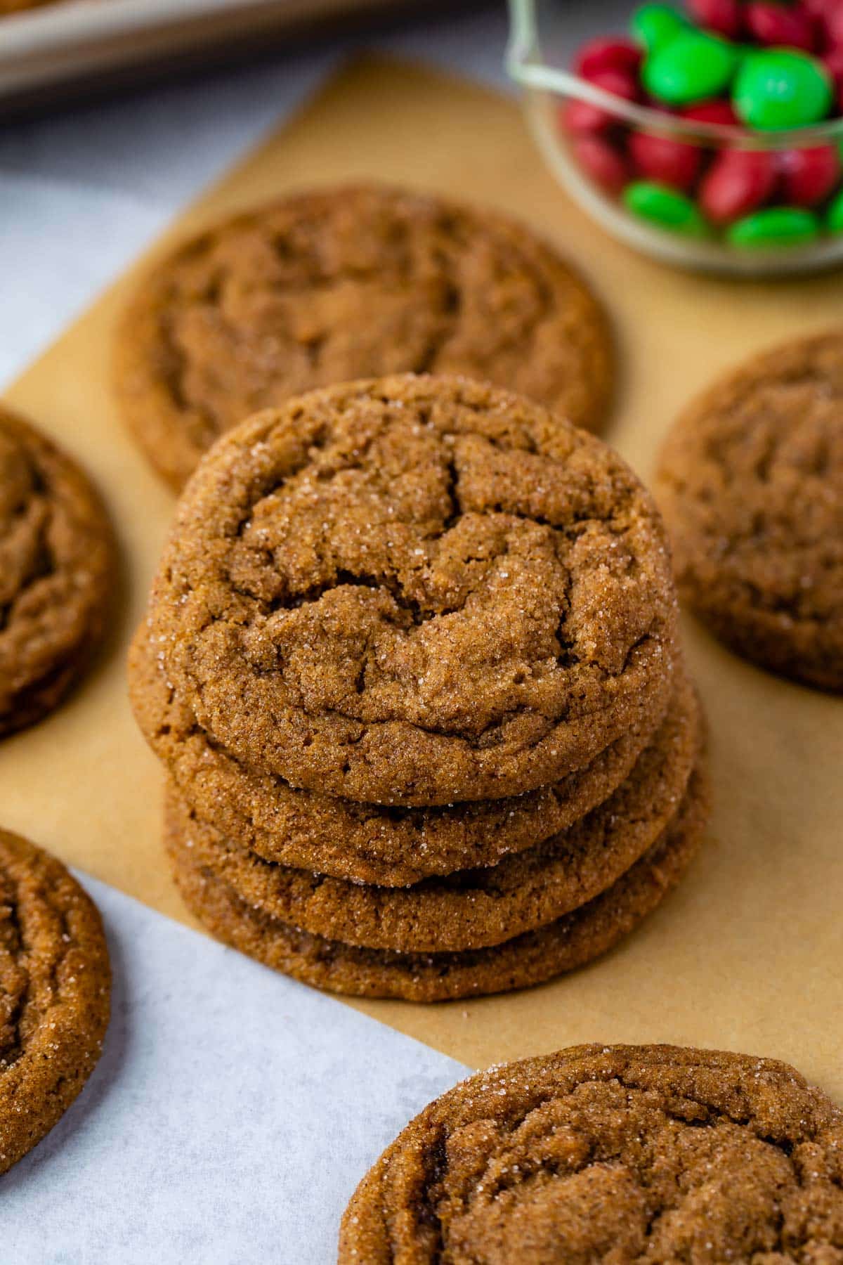 STACK OF 4 MOLASSES COOKIES on brown parchment