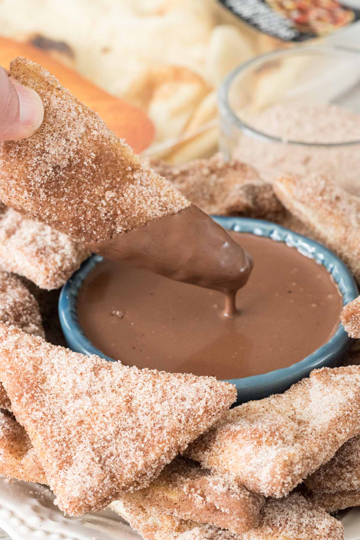 Baked Churro Chips with chocolate ganache dip - this EASY recipe starts with naan and becomes a crunchy churro chip, best dipped in rich chocolate ganache dip!