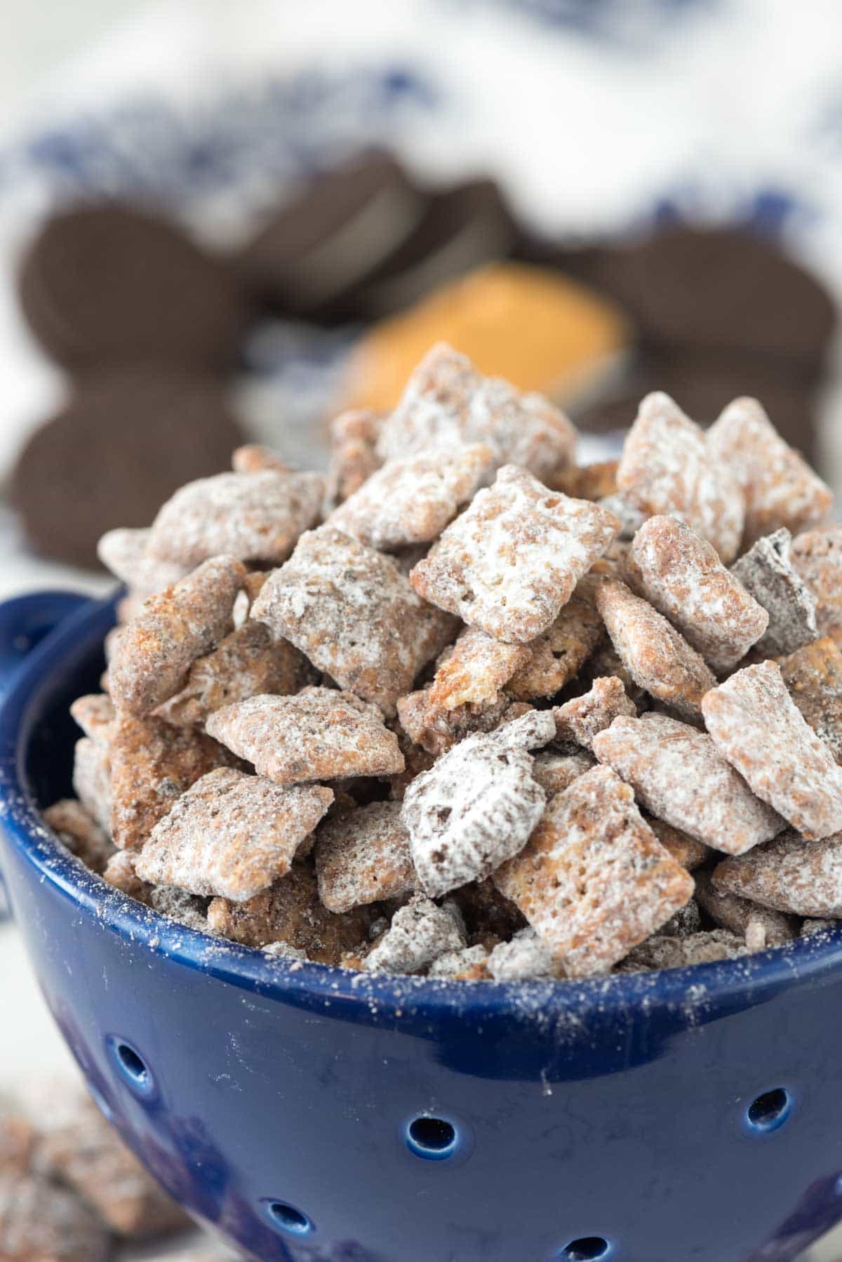 Peanut Butter Cookies 'n Cream Muddy Buddies - this easy puppy chow recipe adds crushed Oreos to the topping! Who knew you could improve on the muddy buddy recipe?