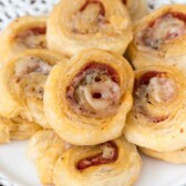 Stacked Pepperoni Pinwheels on a white plate