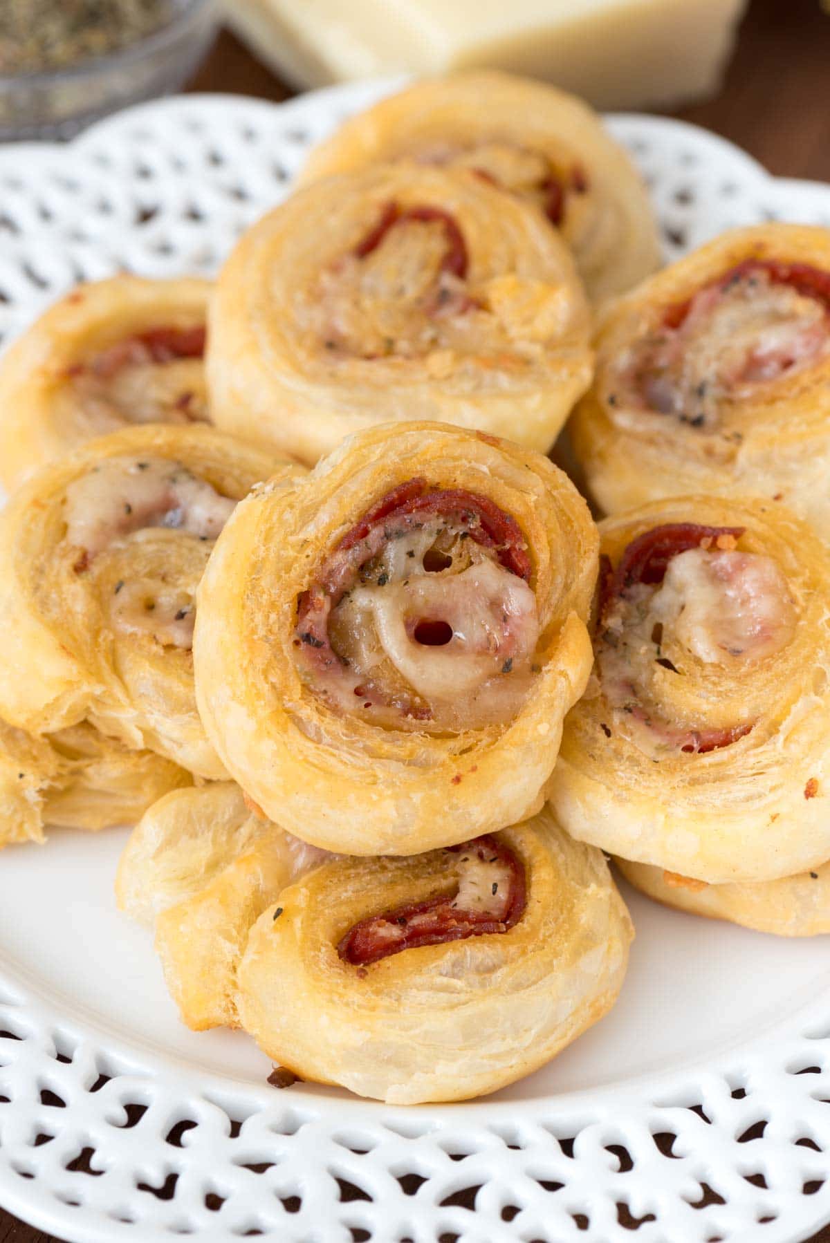 Easy Cheesy Pepperoni Pinwheels - this easy appetizer recipe tastes like mini pizza rolls! EVERYONE loves these and they're always the first to disappear at every party.