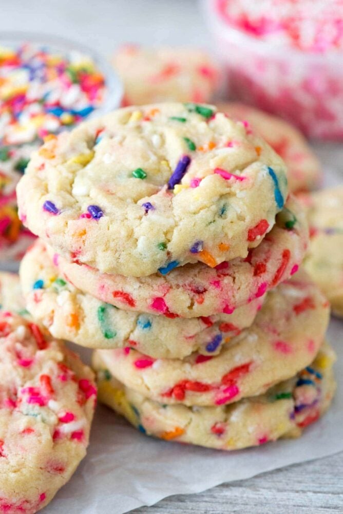 Homemade Sprinkle Cookies stack on parchment paper