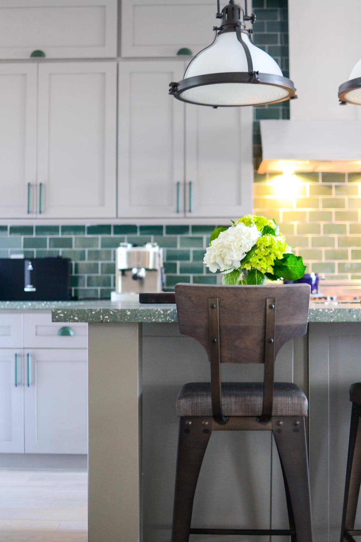 7 Tips for decorating a GREEN kitchen: rustic touches in furniture helps ground the green throughout.
