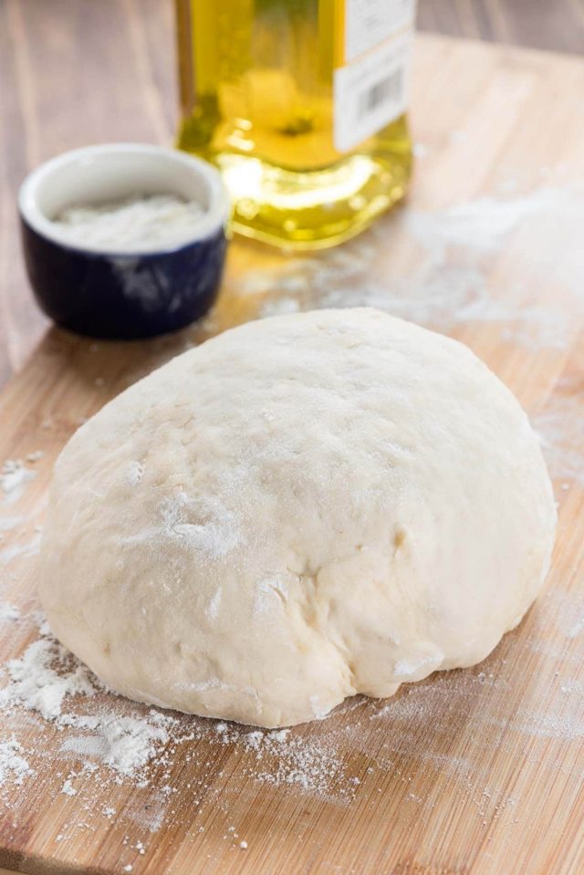 The ULTIMATE Pizza Dough Recipe - this easy pizza dough makes the BEST soft pizza crust. Make white, whole wheat, or even gluten free pizza with this recipe.