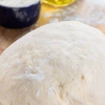 pizza dough on cutting board