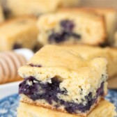 Stack of Blueberry Cornbread on a blue serving plate.