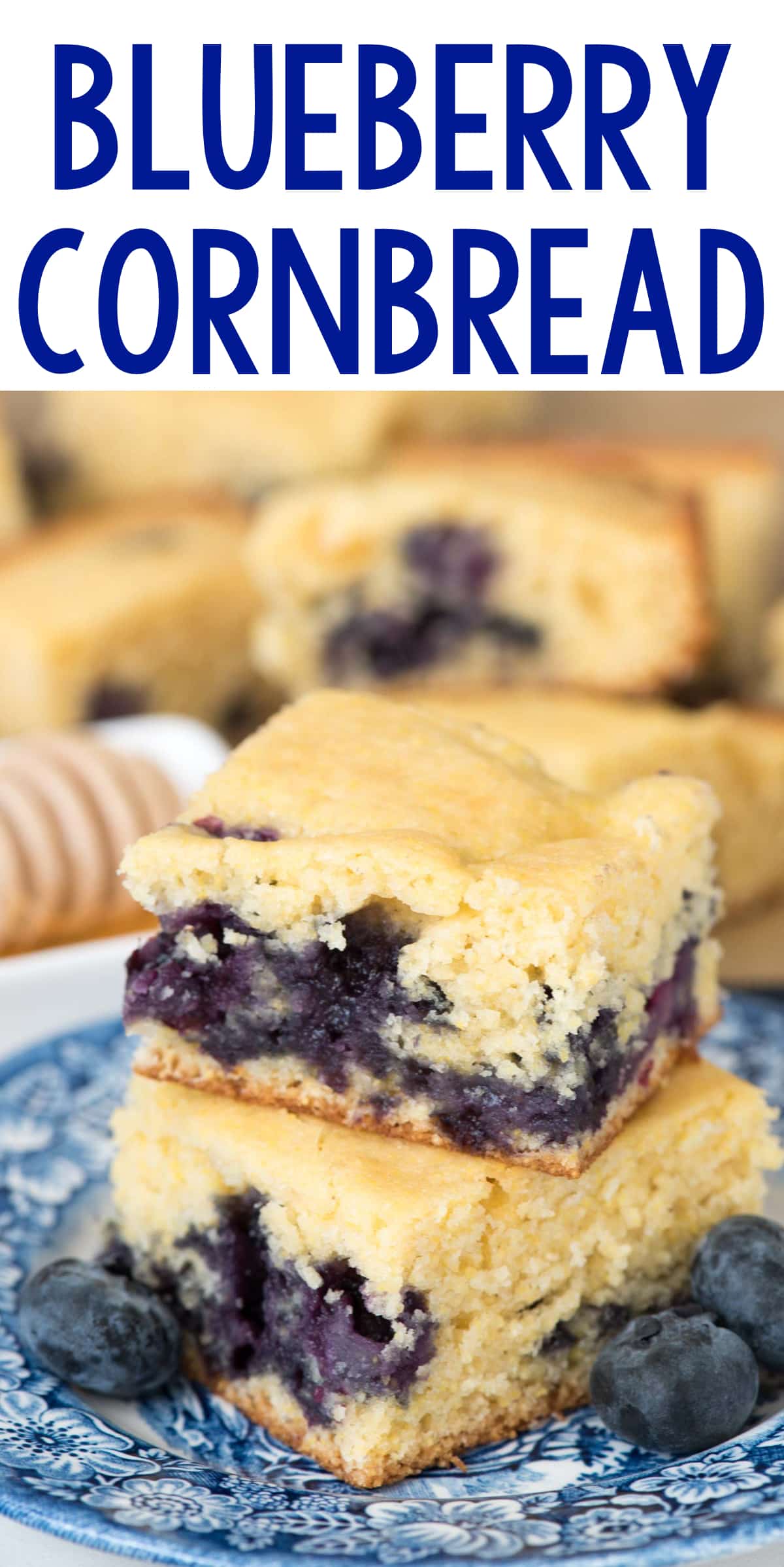 Blueberry Cornbread on a blue plate with blueberries on the side. 