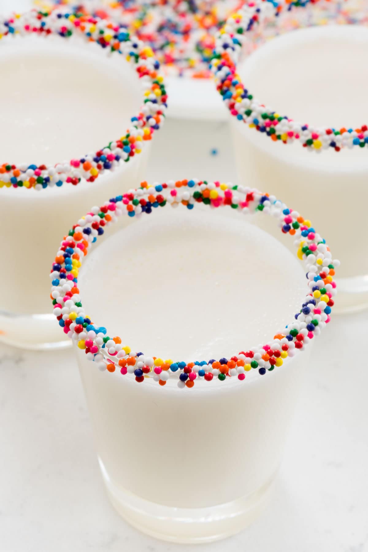 Three Sprinkle Rimmed Frosting Shots