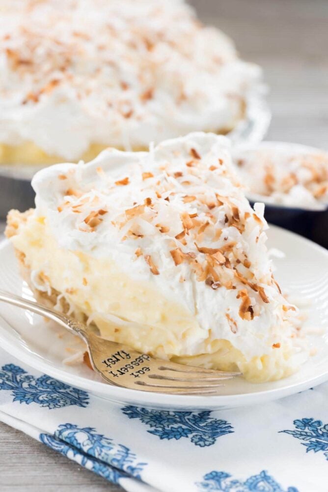 No Bake Coconut Cream Pie on a white plate and blue and white towel