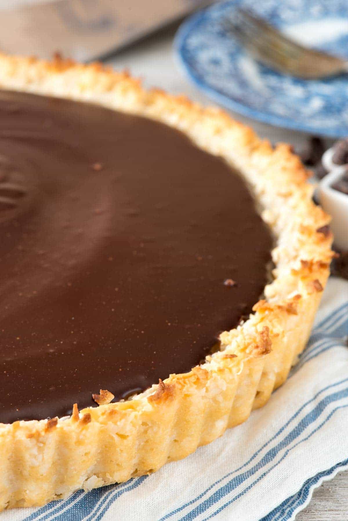 Chocolate Macaroon Pie - this easy macaroon recipe is baked into a pie crust and then filled with a rich chocolate ganache filling! It's the perfect mixture of decadent chocolate and coconut - this pie is always a hit!