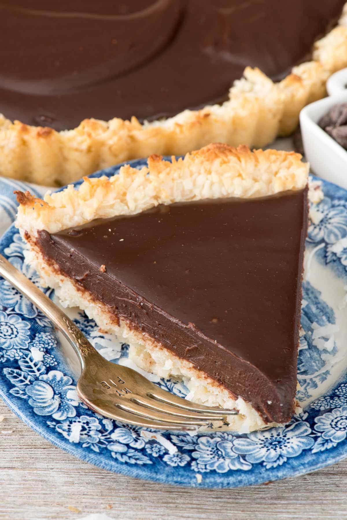 Chocolate Macaroon Pie - this easy macaroon recipe is baked into a pie crust and then filled with a rich chocolate ganache filling! It's the perfect mixture of decadent chocolate and coconut - this pie is always a hit!