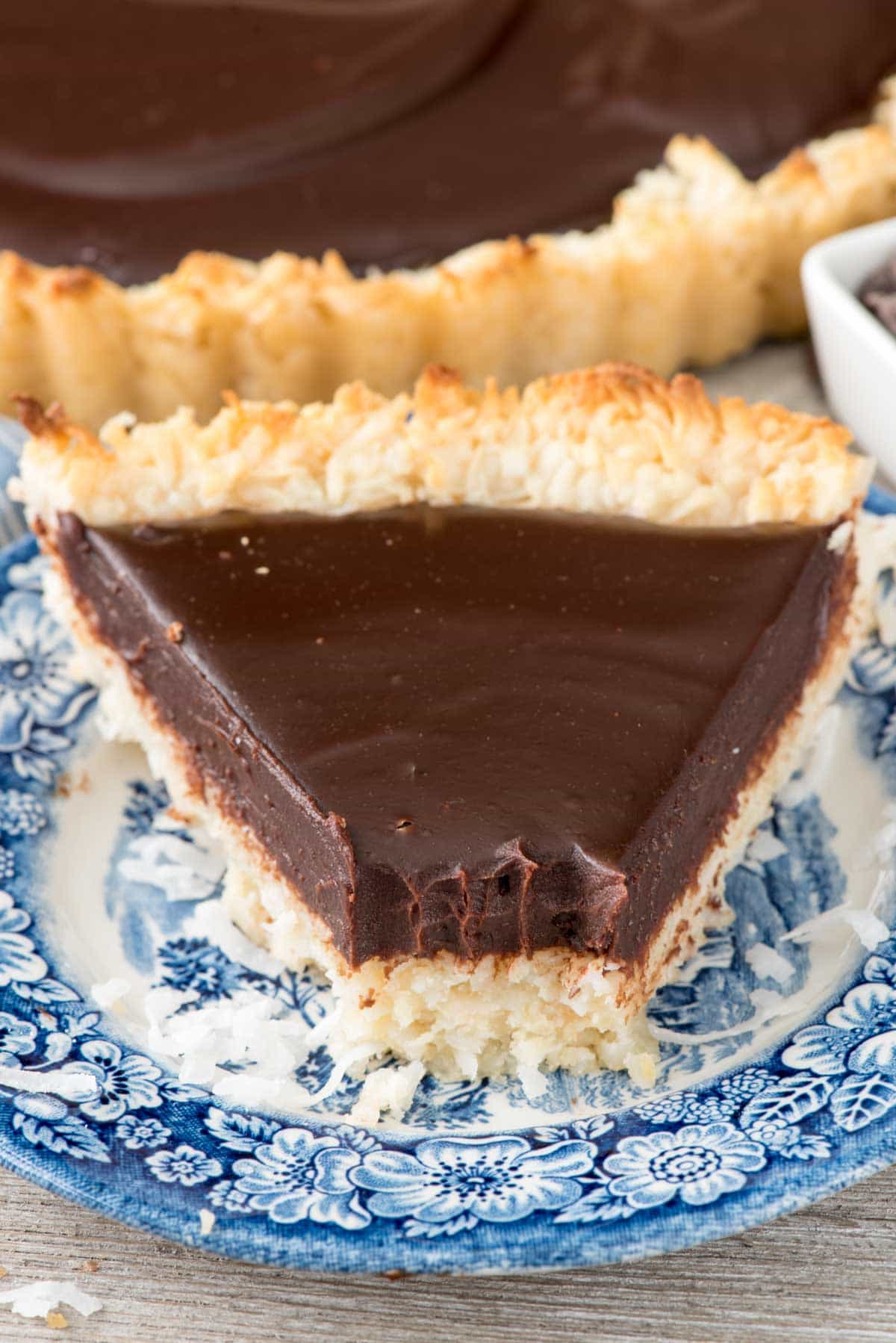 Chocolate Macaroon Pie - this EASY macaroon recipe gets baked into a pie crust and filled with ganache. Betcha can't eat just one bite!