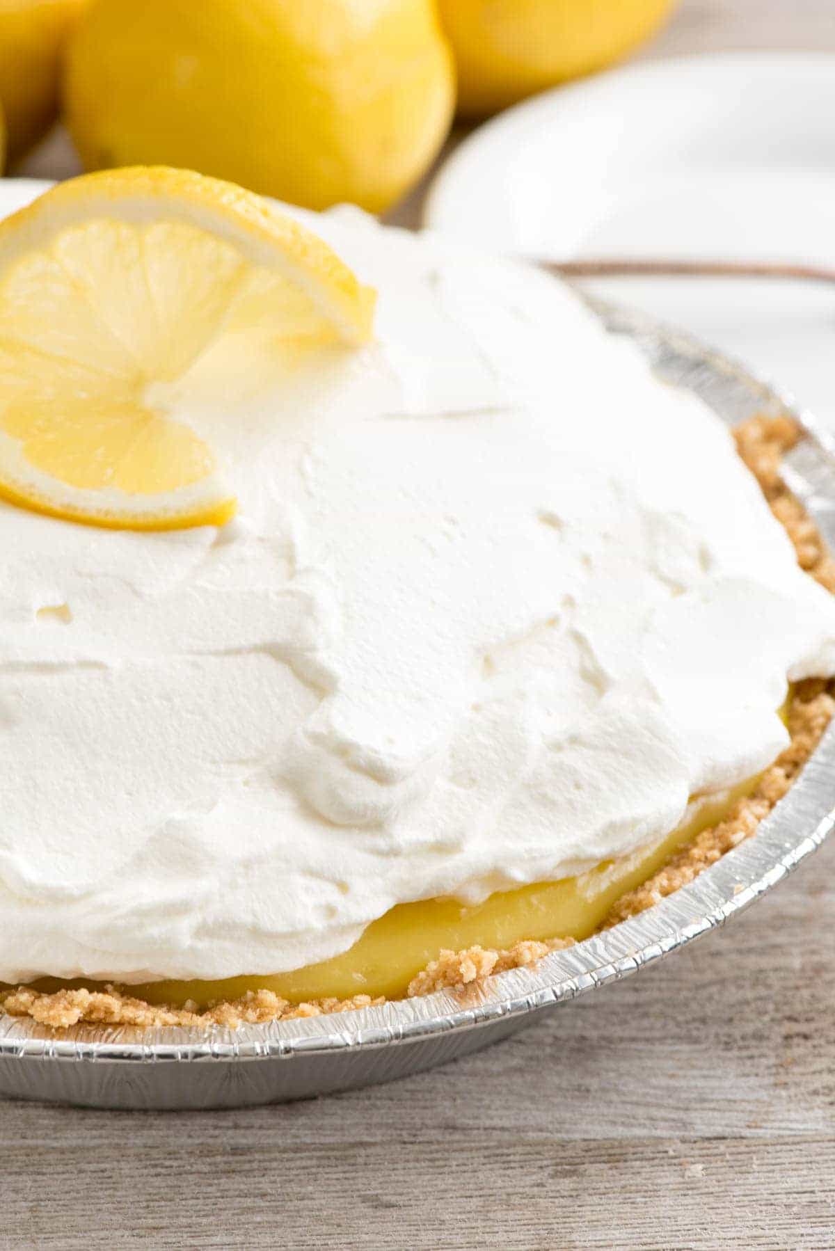 No Bake Lemon Cream Pie - this EASY lemon pie recipe has a homemade vanilla graham cracker crust and is filled with lemon and pudding!  It's the EASIEST lemon pie recipe ever!