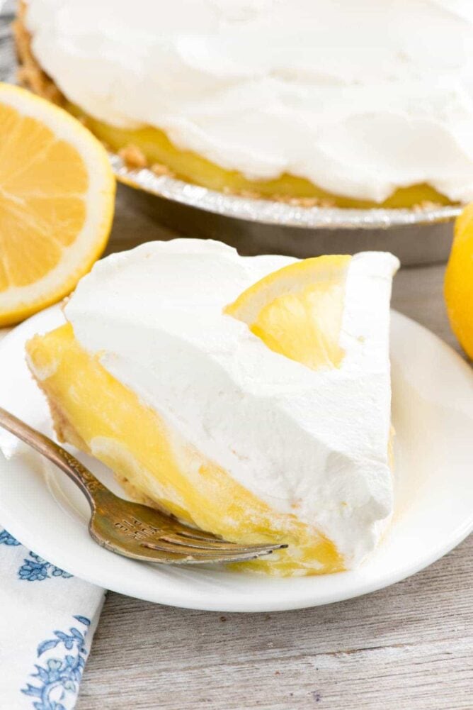 No Bake Lemon Cream Pie on a white plate with a fork