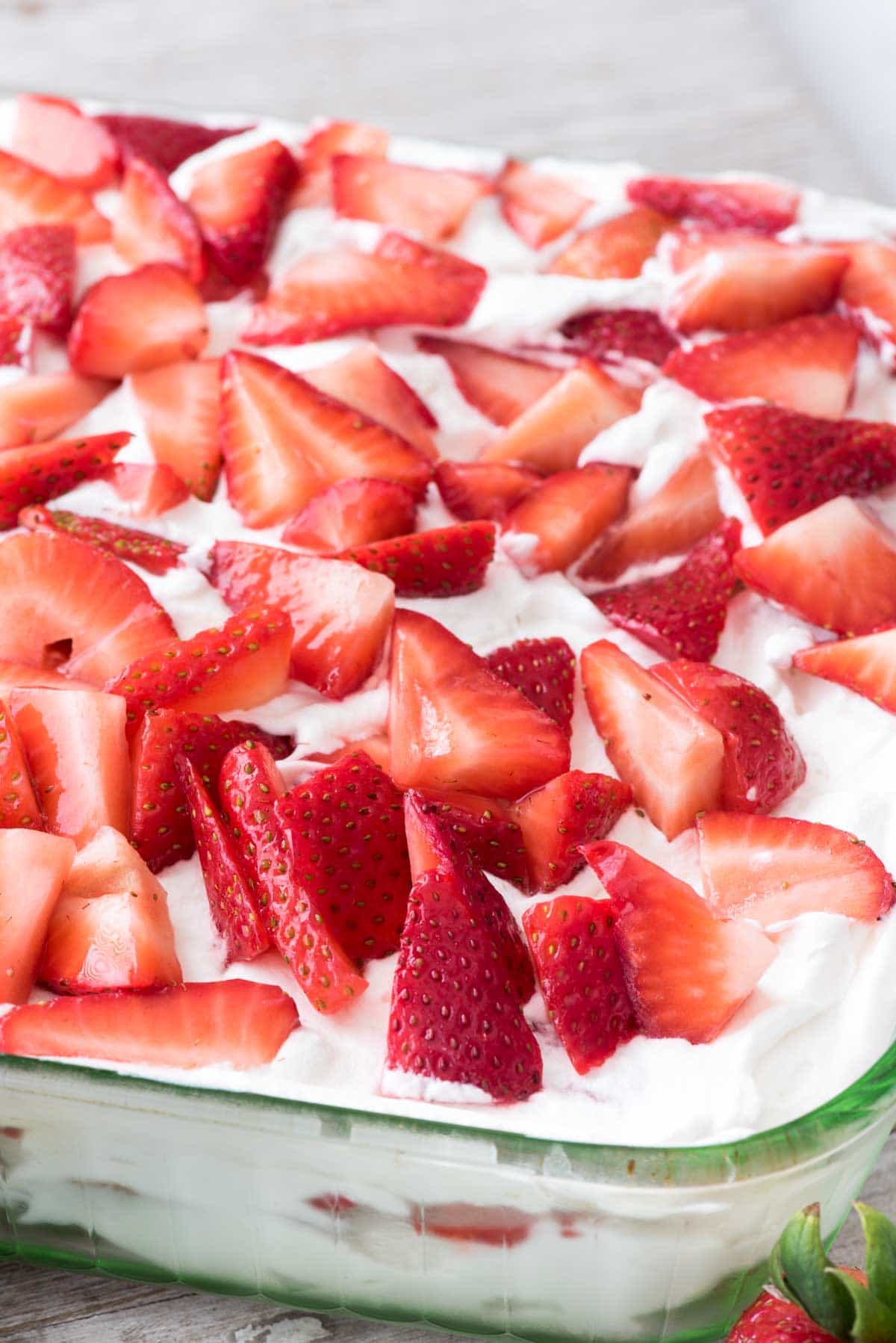 No Bake Strawberry Lemon Cake - this easy lemon cake recipe starts with lemon madeleines and is full of fresh lemon whipped cream and strawberries!