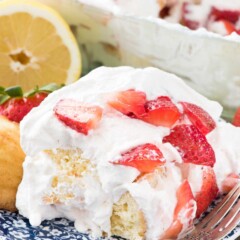 No Bake Strawberry Lemon Cake on a blue plate with a fork