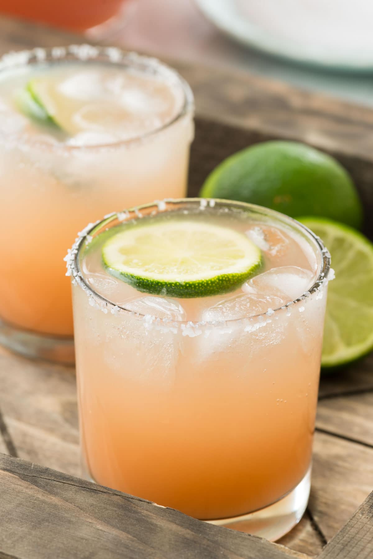 Salty Dog Punch - this easy cocktail recipe is made with grapefruit juice, vodka, and soda with lime for garnish and a salted rim! It's the perfect not-to-sweet spring or summer punch!
