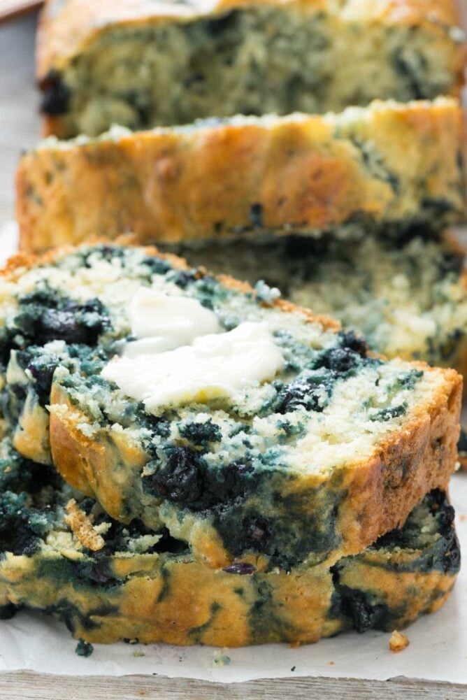 Blueberry Quick Bread slices with butter.