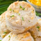 stack of cheddar biscuits on plate