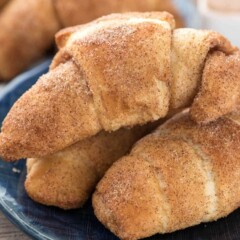 3 Churro Crescent Rolls on a blue plate