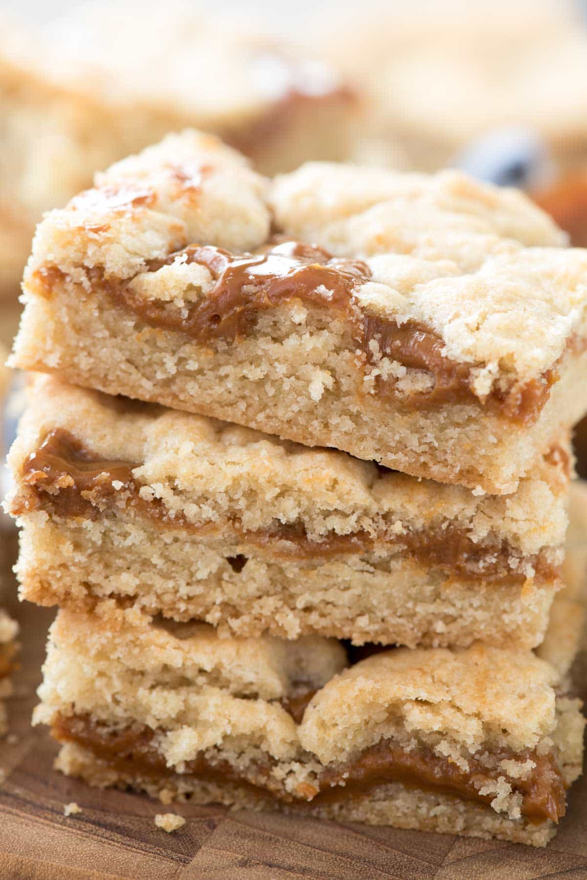 Dulce de Leche Gooey Bars - this EASY sugar cookie bar recipe has gooey dulce de leche inside! Cookie bars with caramel are always a hit!