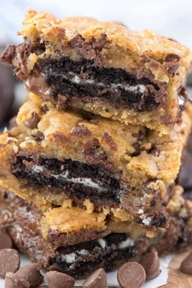 oreos stuffed inside cookie bars in a stack