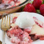 Easy Strawberry Cobbler on a white plate with a fork