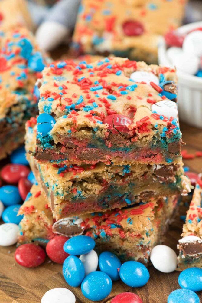 Fireworks Blondies stacked on top of each other with red, blue and white M&Ms around them