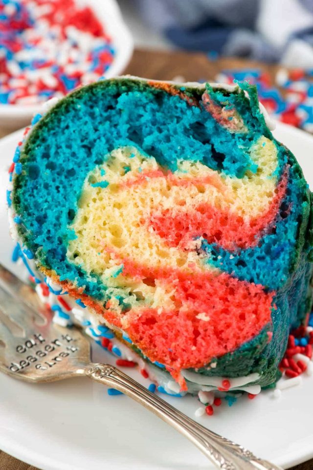 Fireworks Bundt Cake - this easy bundt cake recipe starts with a cake mix. Doctor it up to make a soft and delicious bundt cake that is accidentally dairy free. Tie dye it for the 4th of July!