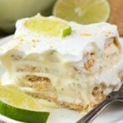 Easy No Bake Key Lime Eclair on a white plate with a fork