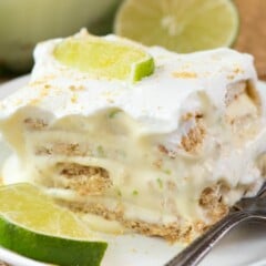 Easy No Bake Key Lime Eclair on a white plate with a fork