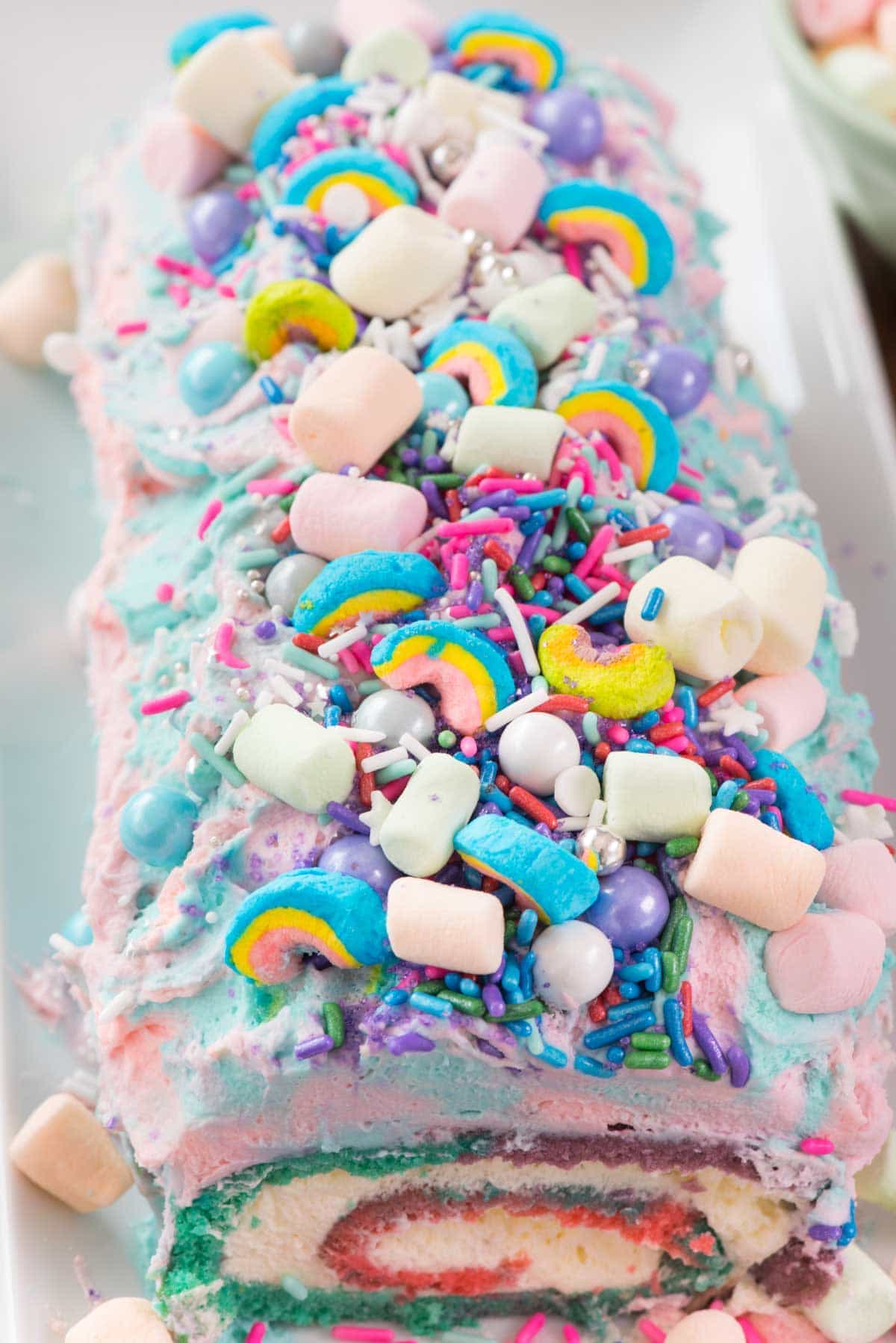 Unicorn Cake Roll on a white serving dish