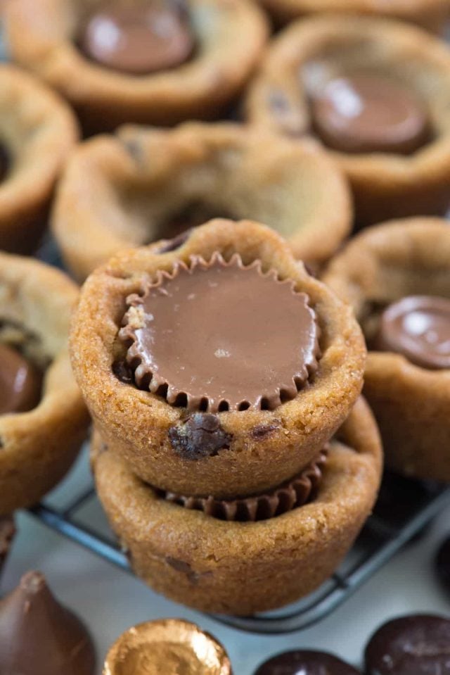 EASY 2 ingredient cookie cups! Use your favorite cookie dough recipe or packaged dough to make an easy treat everyone loves. Add your favorite candy for a fun surprise!