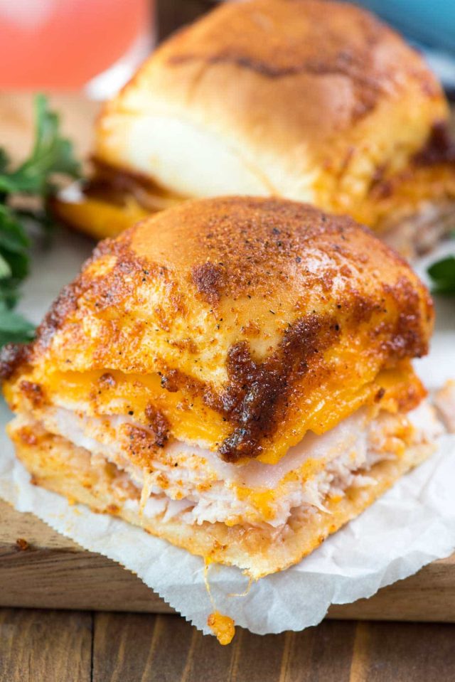 BBQ Turkey Cheddar Sliders - this easy sliders recipe is full of turkey, cheese, and barbecue flavoring! The topping tastes JUST like a BBQ chip!