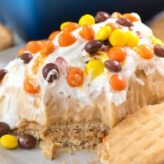 slice of icebox cake on plate with cookie.