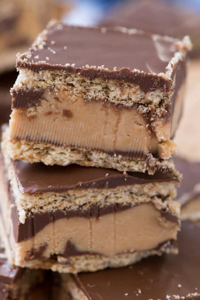 Disneyland Peanut Butter Sandwich Bars in a stack - this no bake bar cookie is better than the Disneyland Peanut Butter Sandwich. Graham crackers sandwiched with a thick peanut butter layer and lots of chocolate!