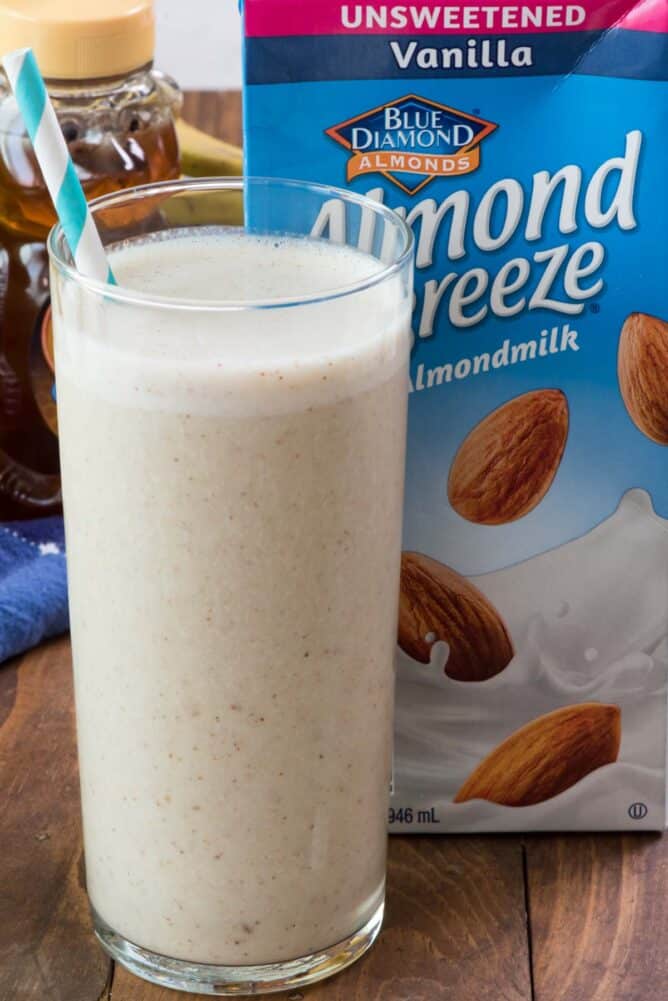 Honey Banana Smoothie in glass with almond breeze container