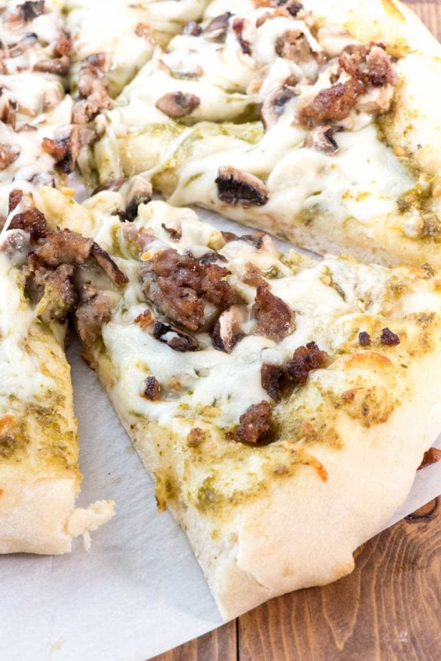 Mushroom Sausage Pesto Pizza - everyone loves pizza night! This easy dinner recipe has pesto for the sauce and it goes so well with the sausage and mushroom topping!