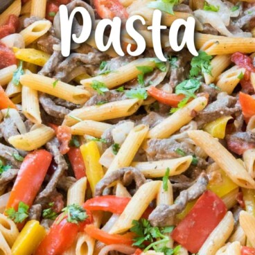 pan of pasta and steak and peppers