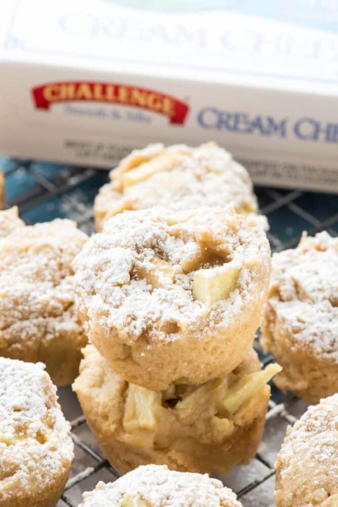 Apple Cheesecake Cookie Cups in a stack with challenge cream cheese behind