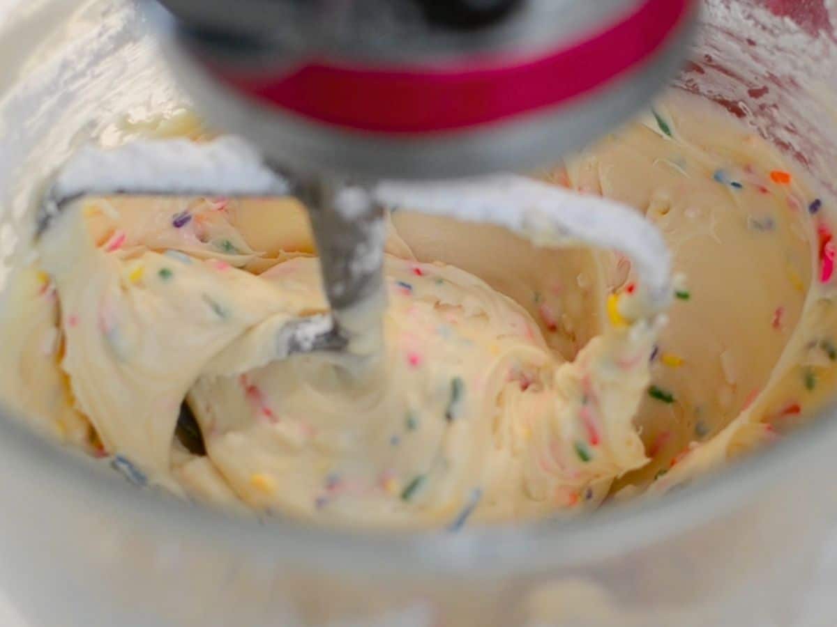 mixer with frosting and sprinkles.