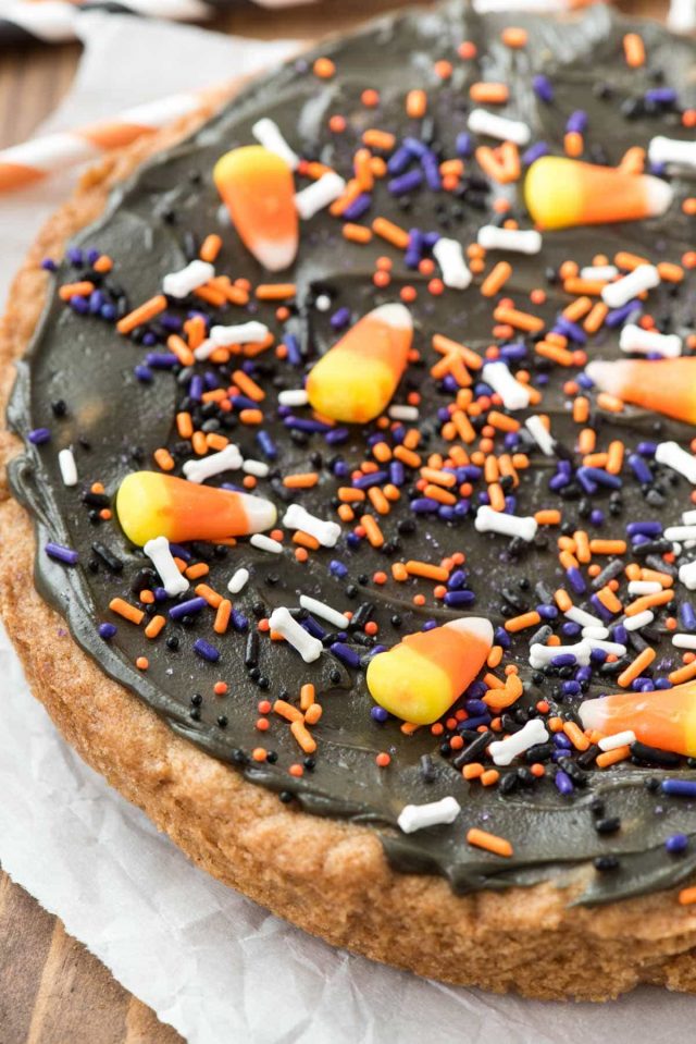 EASY Halloween Pumpkin Cookie Cake - the most fun Halloween treat! Thanks to a pumpkin cookie mix this recipe is made in minutes!! 