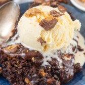 Slow Cooker Peanut Butter Brownie Pudding on a blue plate