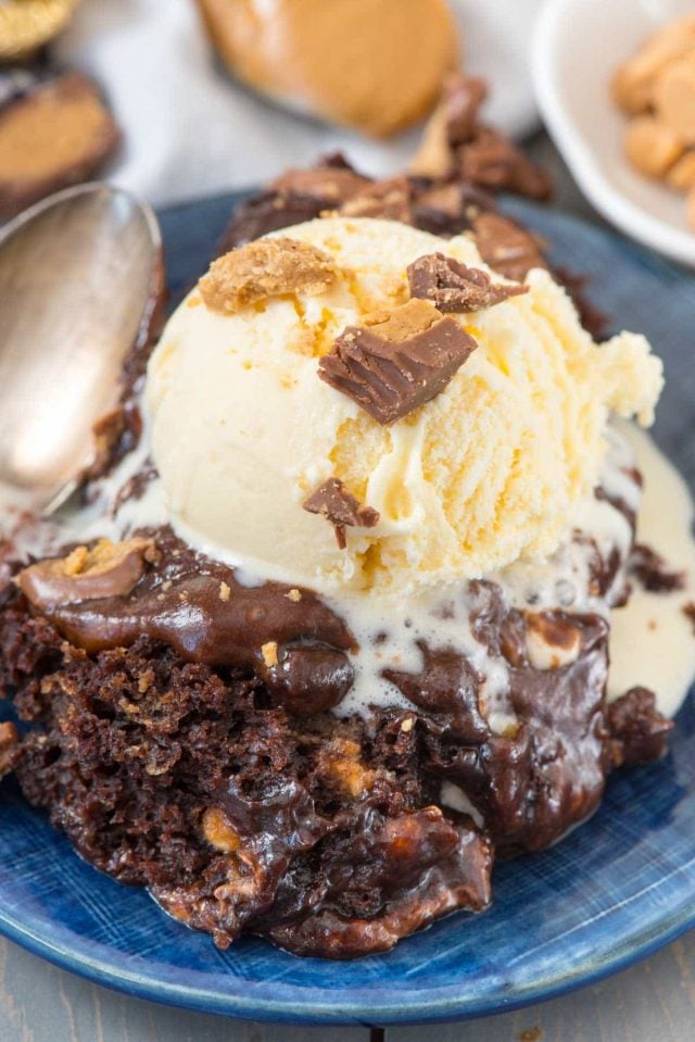 Slow Cooker Peanut Butter Brownie Pudding - chocolate brownie mix and pudding mix cooked in the crockpot with peanut butter and peanut butter cups! This easy indulgent dessert recipe is one everyone loves!