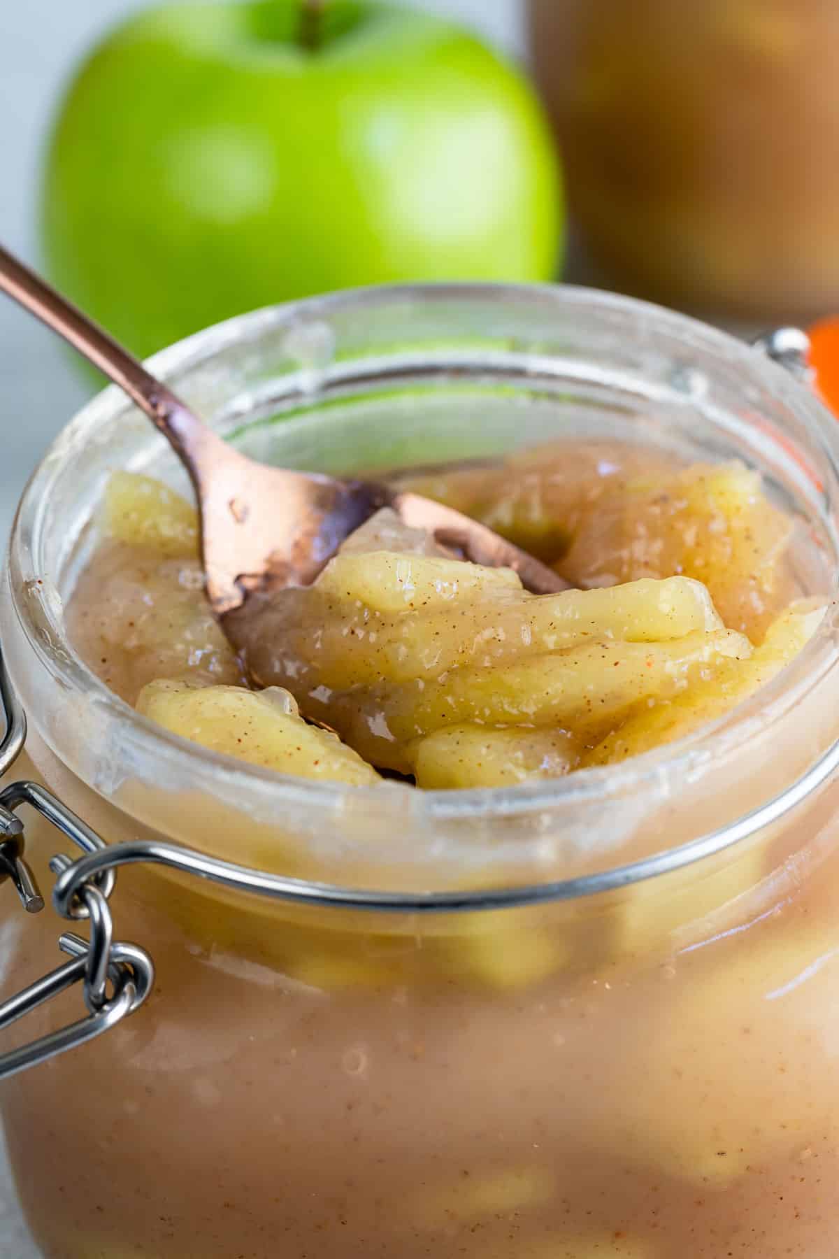 jar of apple pie filling with spoon