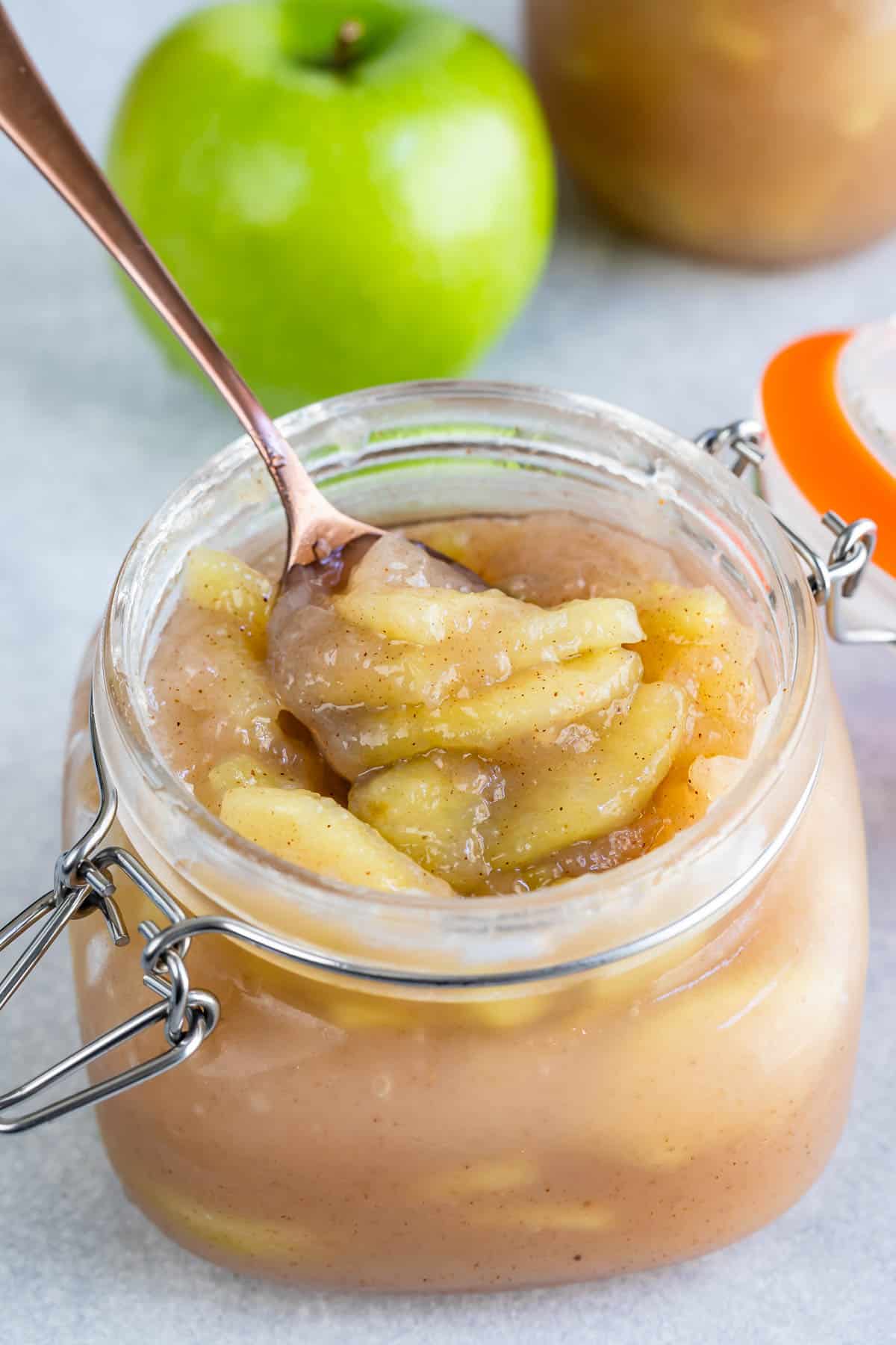 jar of apple pie filling with spoon